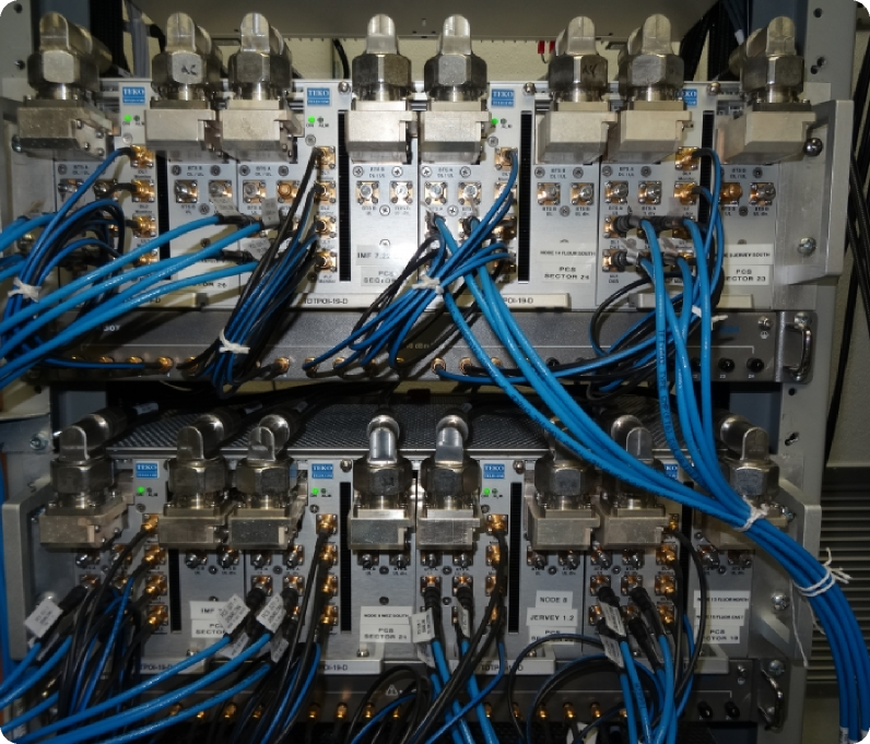 DAS head-end equipment rack with neatly dressed RF jumpers