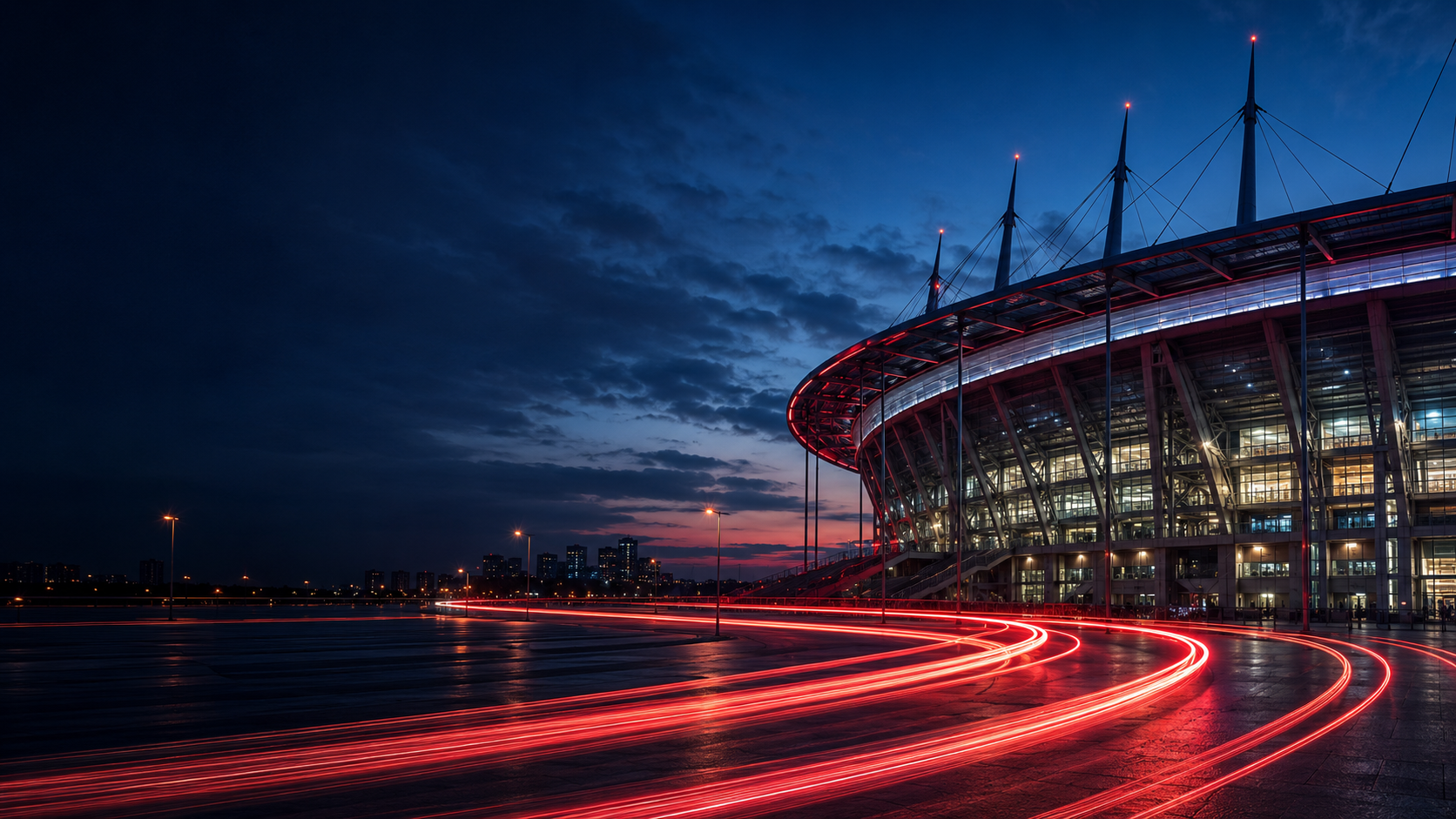 Modern stadium at dusk with red light-trail streaks suggesting wireless signal
